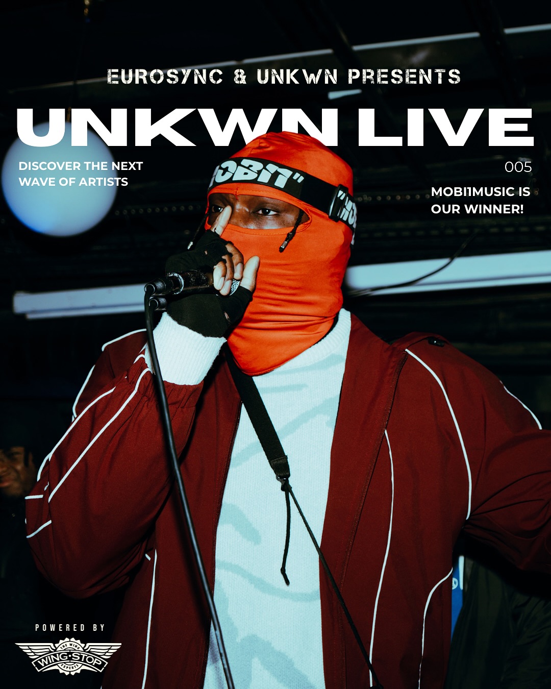 Red-masked performer at the EuroSync and UNKWN Live rap cypher