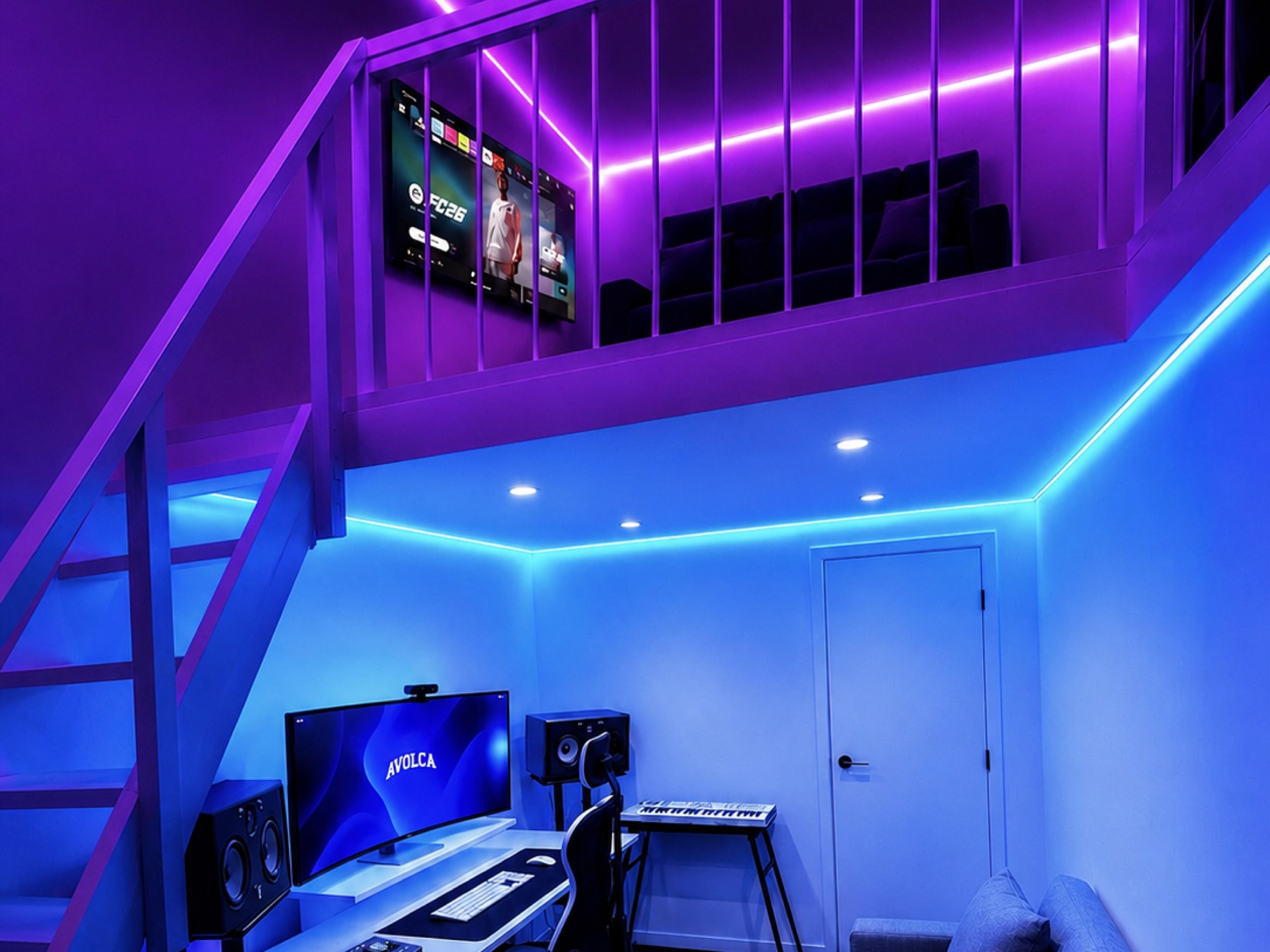 AVOLCA Studios — the mezzanine lounge above and the desk, Focal monitors and keyboard below, joined by the staircase